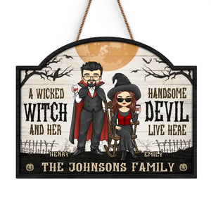 A Wicked Witch And Her Handsome Devil Live Here - Couple Personalized Custom Home Decor Wood Sign - Halloween Gift For Husband Wife, Anniversary